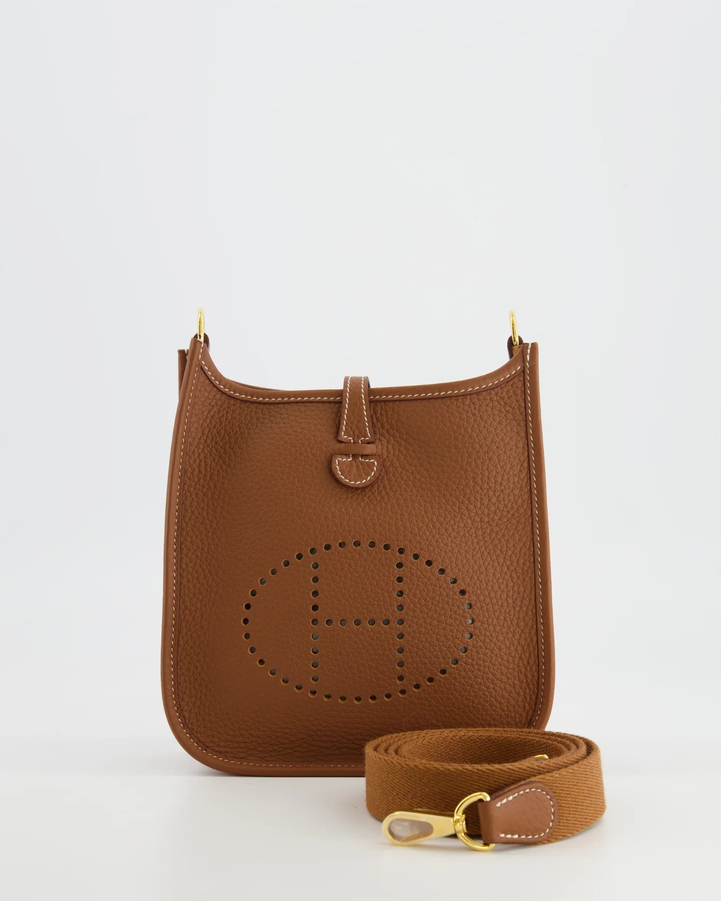 Front Close-up of Gold Clemence leather on a Hermès Mini Evelyne handbag.