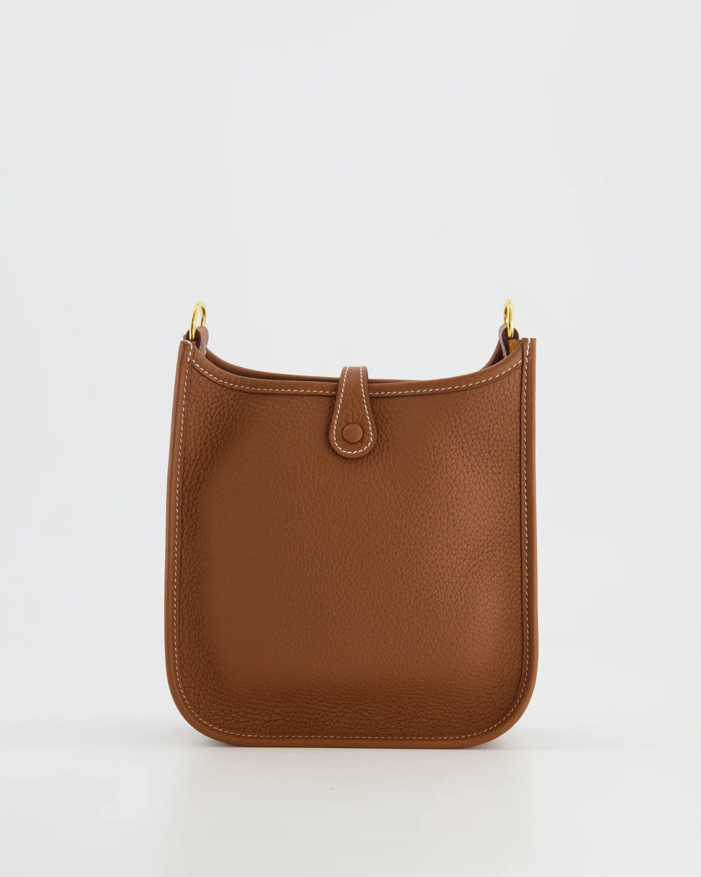 Gold Clemence leather on a Hermès Mini Evelyne handbag.