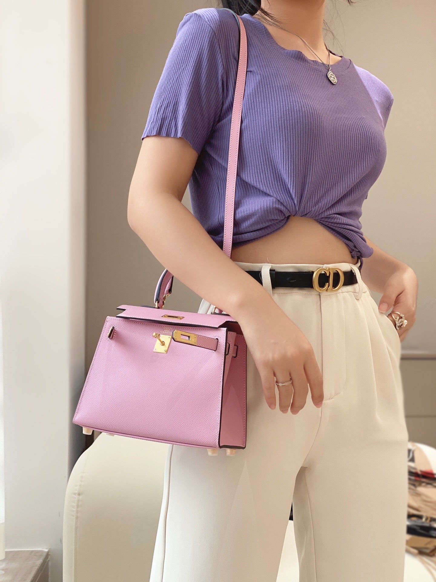 Model carrying a stylish pre-order Kelly Palm Pattern Leather Handbag.